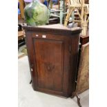 George III Oak Hanging Corner Cupboard, the single panel door opening to reveal three shaped