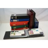 A large quantity of first day covers in albums.