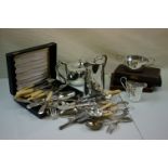 A quantity of silverplate to include tea set and cutlery.