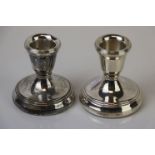 A pair of fully hallmarked sterling silver candlesticks