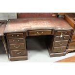 19th century Mahogany Twin Pedestal Inverted Breakfront Mahogany Desk with an arrangement of nine