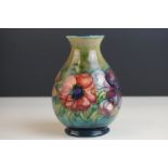 Moorcroft Baluster Vase in the Anemone pattern on a green ground, Moorcroft signature to base and