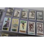 A vintage collection of mixed cigarette and tea cards contained within two albums to include Ogdens,