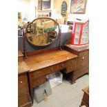 Edwardian Mahogany Inlaid Dressing Table with oval mirror, arrangement of four drawers and raised on