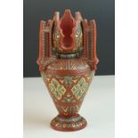 A late 19th century art nouveau pottery vase with painted decoration.