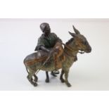 A Austrian Franz Bergman cold painted bronze of a middle eastern figure with donkey, signed to