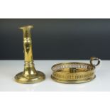 A brass chamber stick and a Telescopic brass candlestick.