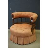 Victorian Low Armchair, the bow back with button upholstered top rail and turned spindle supports,