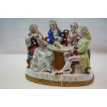 A Capodimonte style porcelain group of figures playing cards.