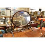 Late 19th / Early 20th century Oval Swing Mirror raised on a slender turned stand, 60cms wide x