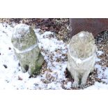 A pair of composite stone lion figures