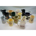 Collection of Fifteen Ceramic Pub Advertising Jugs including Wade and Martell Grand National Void