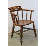 Victorian Elm Seated Captain's Tub Chair, the horseshoe shaped back with turned spindles, 84cms high