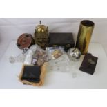 A box of mixed collectables to include knife rests, clock and fishing reel.