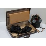 A vintage leather Travelite attache case together with a pair of minolta binoculars a Zenith pair of