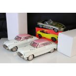 Two boxed tin plate friction powered cars in pink & white, plus a boxed Sport Lady Jaguar in silver,