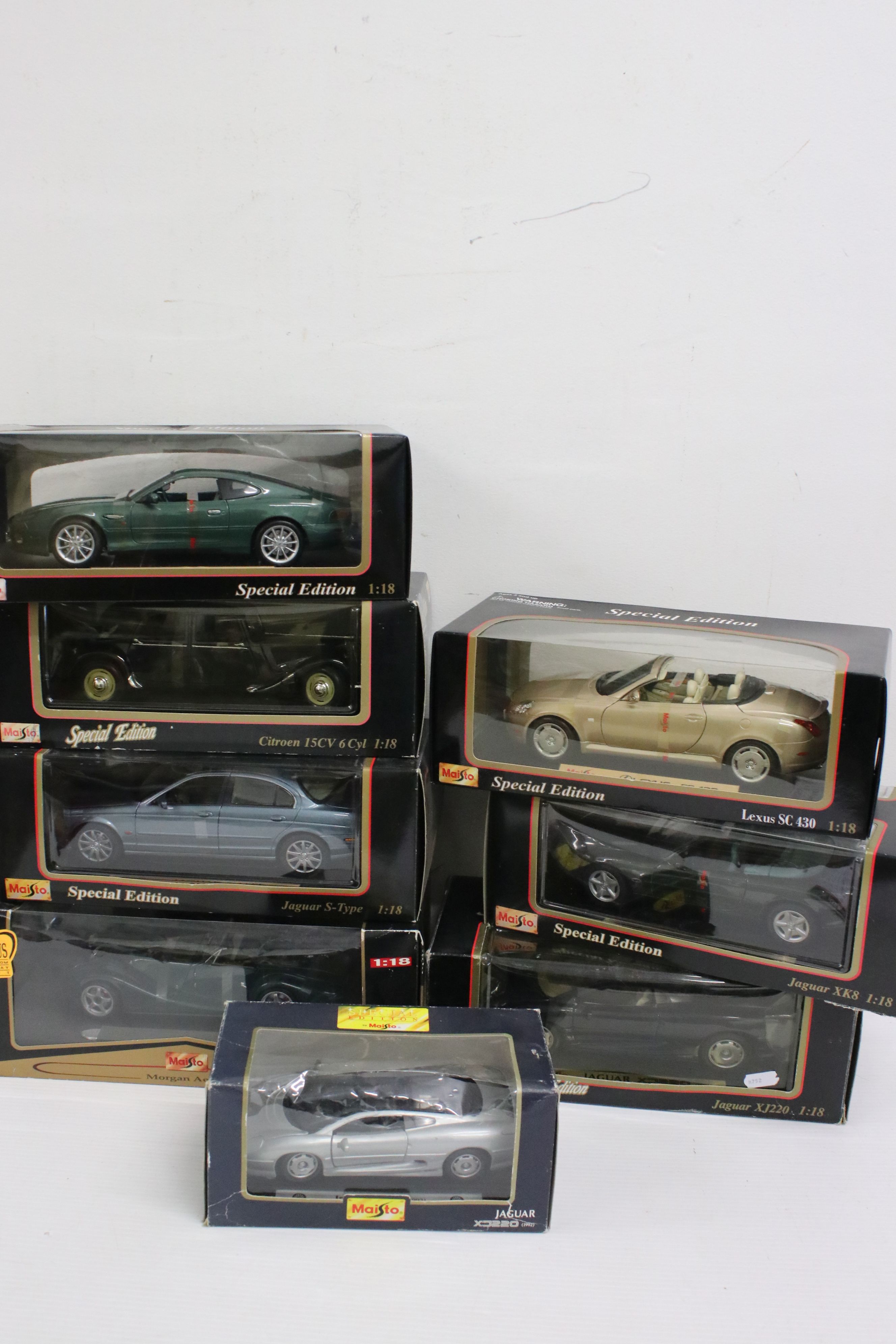 Eight boxed Maisto diecast models to include 7 x 1:18 scale models featuring Jaguar XK8, Jaguar