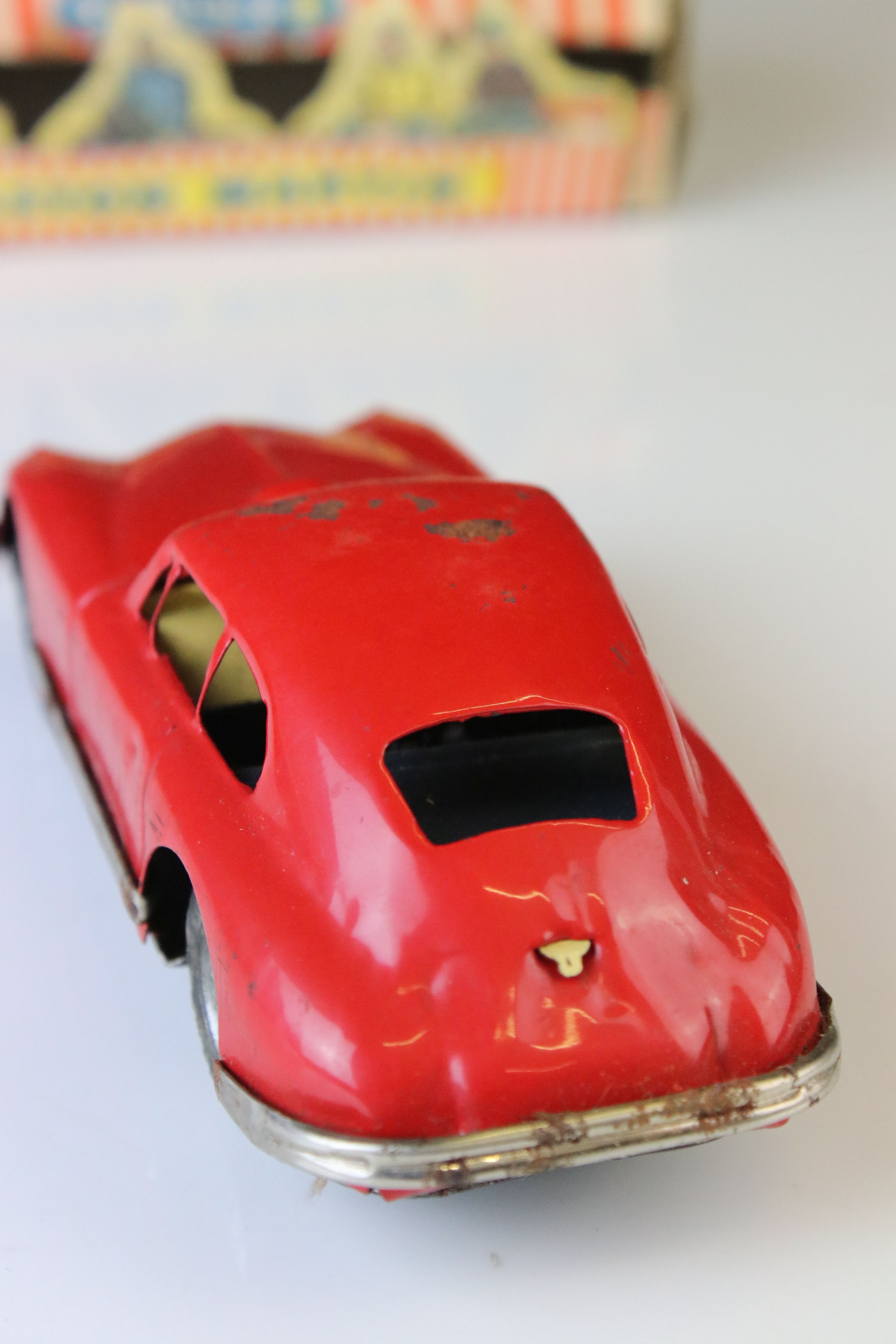 Boxed Scalex tin plate clockwork Aston Martin DB2 model in red, showing play wear with wear to - Image 4 of 8