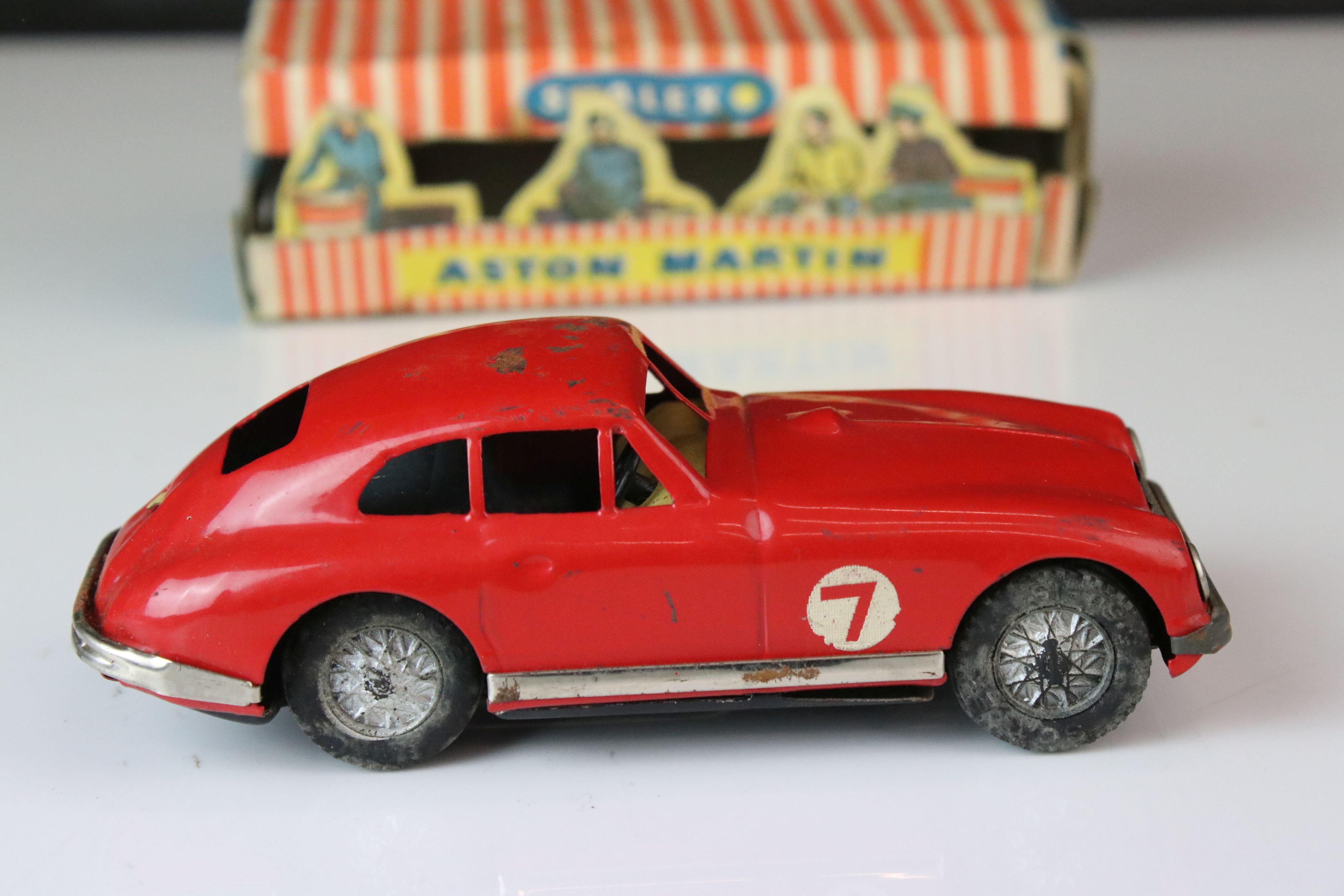 Boxed Scalex tin plate clockwork Aston Martin DB2 model in red, showing play wear with wear to - Image 2 of 8