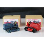 Two Dinky Supertoys 563 Heavy Tractor diecast models, variants in red & blue, both showing paint