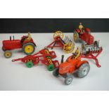 Three Dinky diecast tractors featuring 2 x Massey Harris & 301 Field Marshall plus 3 x Dinky farming