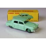 Boxed Dinky 172 Studebaker Land Cruiser diecast model in mint green, dark green hubs, showing play