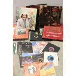 A quantity of LP's and 7" singles to include The Beatles, Bad Manners, Status Quo, Kate Bush, Queen