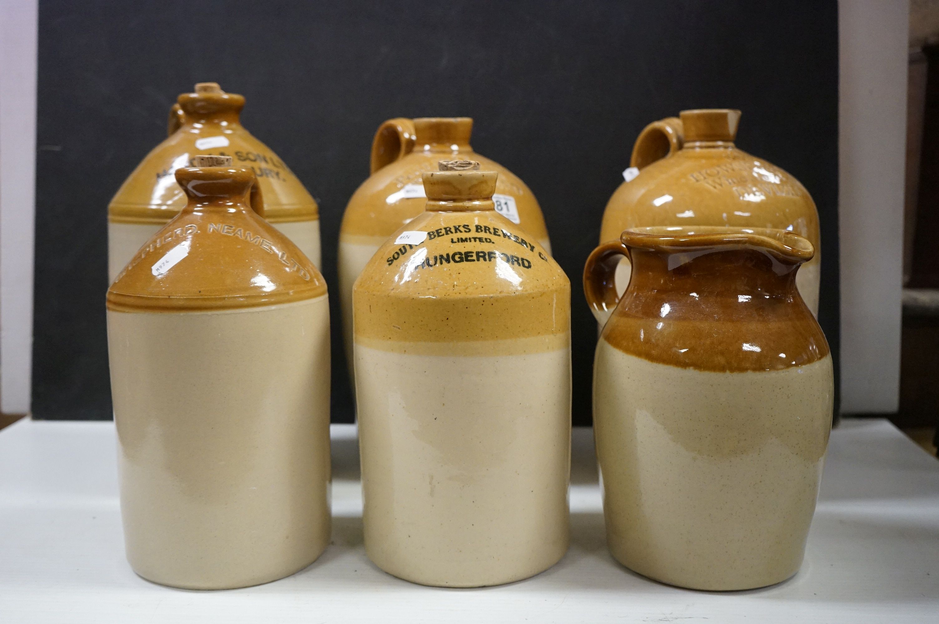 Six antique stoneware flagons to include Wexford, Devizes Bradford etc and a similar jug. - Image 2 of 9