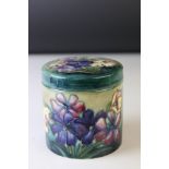 A mid 20th century Moorcroft lidded jar with flower decoration.