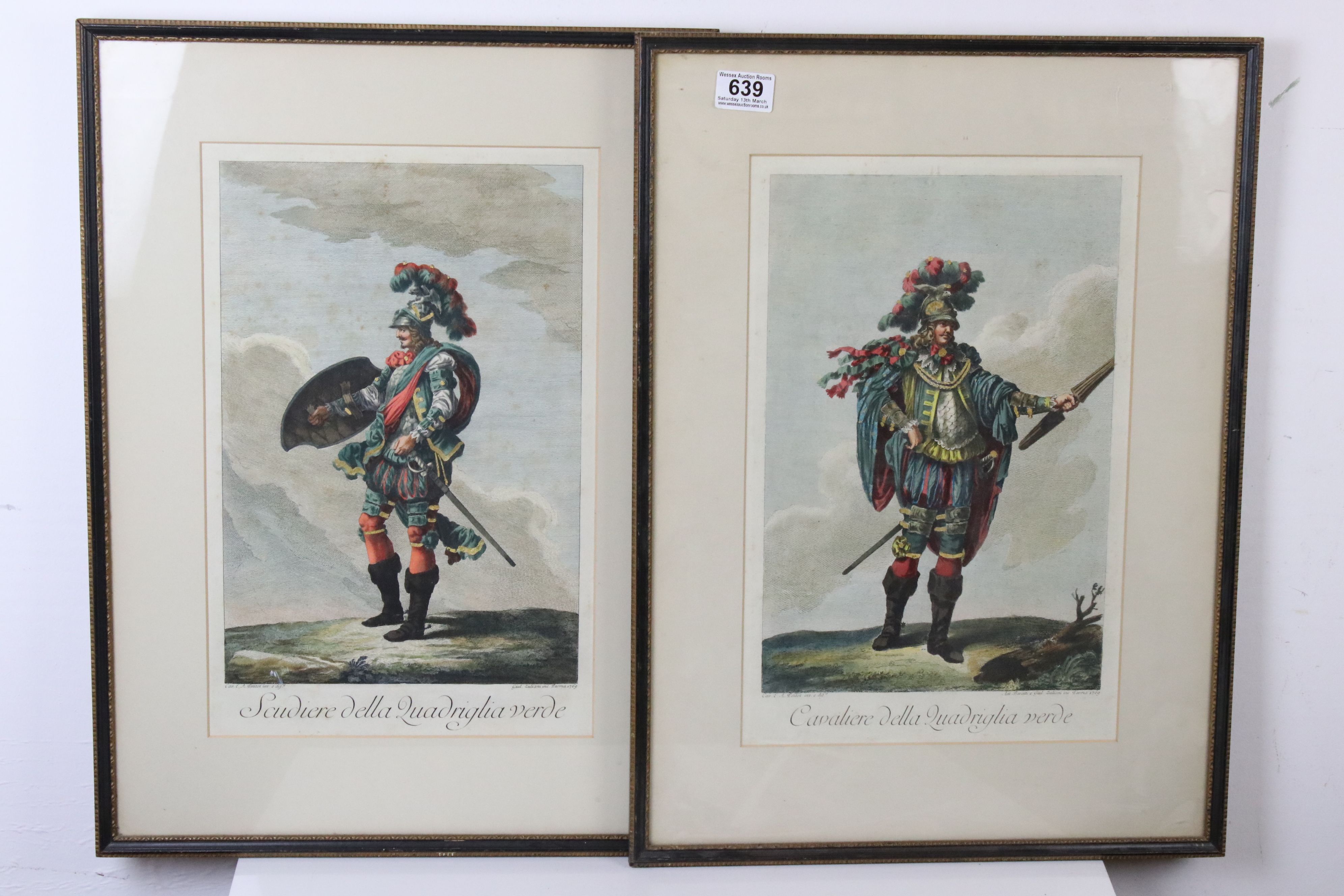 A pair of framed antique continental coloured engravings of 18th century Cavalier in costume.