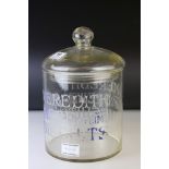 An early 20th century glass lidded Biscuit Barrel jar with etched decoration advertising Meredith