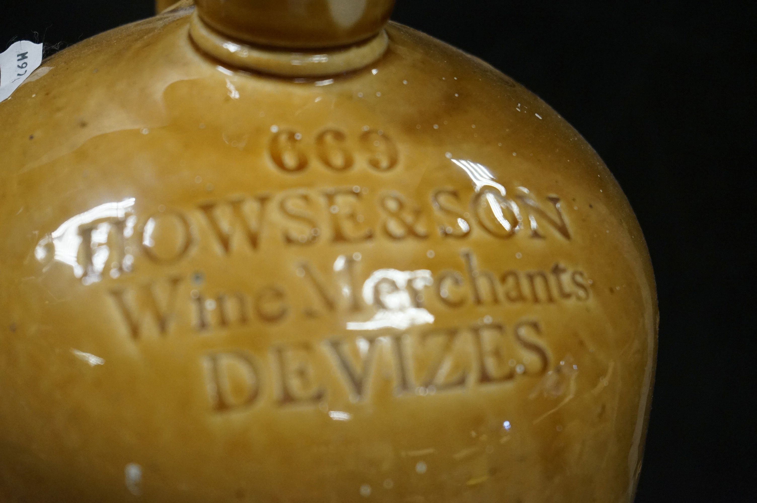 Six antique stoneware flagons to include Wexford, Devizes Bradford etc and a similar jug. - Image 8 of 9