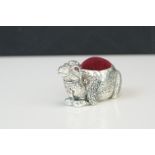 Large silver plated camel pin cushion with ruby eyes