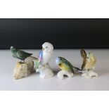 four bird figures to include Karl Ens wren and Blue Tit a Vista Algre Parrot and a stone bird.