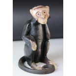 Cast Iron Money Box in the form of a seated monkey, 20cms high