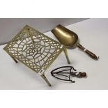 An antique brass pan stand with pierced decoration a similar trivet and an early 20th century