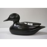 A contemporary carved wooden duck decoy style figure.
