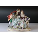 A Sitzendorf ceramic group of two young lovers in 18th century costume.