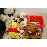 A group of teddy Bears and a Winnie The Pooh pyjama case etc.