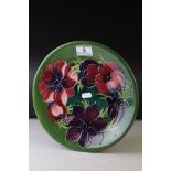 Moorcroft Plate in the Clematis pattern, green signature to base and impressed Moorcroft mark, 26cms