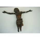 An antique carved wooden figure of Jesus.