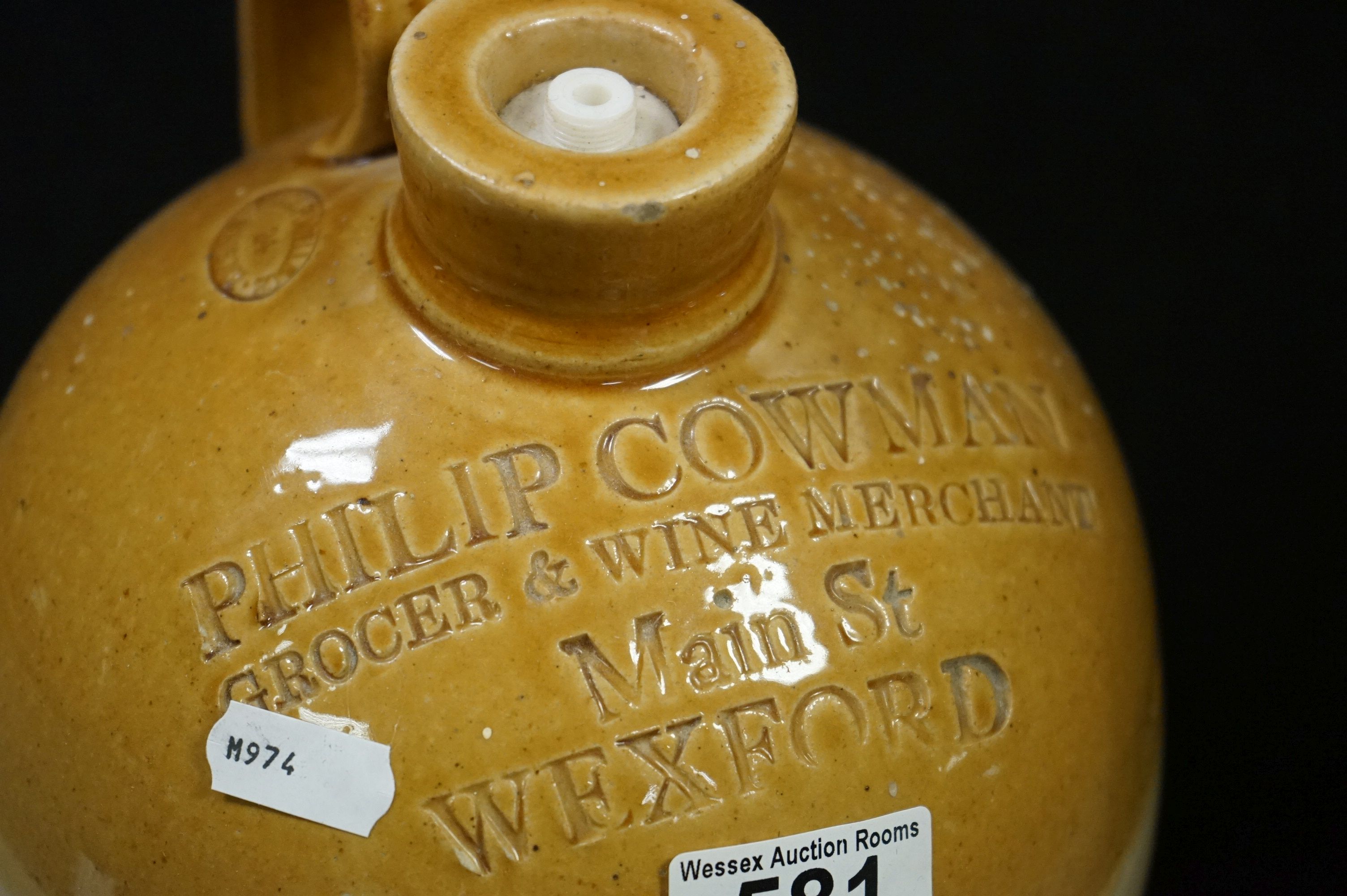 Six antique stoneware flagons to include Wexford, Devizes Bradford etc and a similar jug. - Image 6 of 9