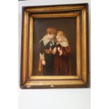 A vintage framed coloured print of a young girl and boy in 19th century costume.