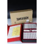 A contemporary Oriental boxed Mahjong set.