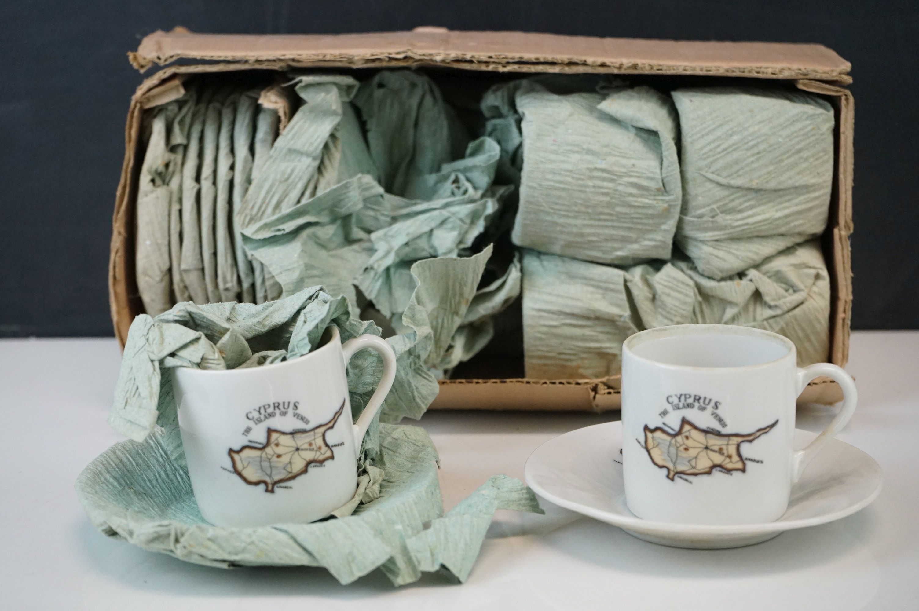 A vintage coffee set decorated with the image of the island of Cyprus.