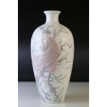 A Lladro vase decorated with a woman seated in a tree.
