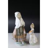 A Lladro figure of a girl with pleated dress and head scarf together with a figure of girl with