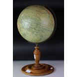 A 1920s Philips Educational Terrestrial Globe with turned wooden base.