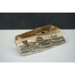 A Resin Scrimshaw Style Box in the form of a Coffin, with etched whaling scene to top, the inside