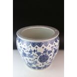 A large blue and white oriental Jardiniere planter with floral decoration to the body and Greek